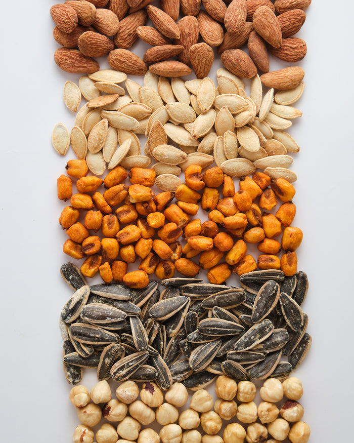 Real photo of roasted Nefisso ingredients with chickpeas, corn, nuts and seeds